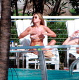 Jennifer Aniston sunbathing in bikini at her hotel in Miami Beach