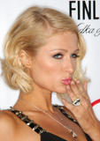 Paris Hilton in black low-cut dress at In Touch Weekly's Summer Stars Party in Los Angeles