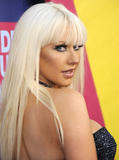 Christina Aguilera shows deep cleavage in black dress